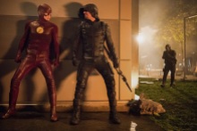 The Flash -- "Invasion!" -- Image FLA308c_0466.jpg -- Pictured (L-R) Grant Gustin as The Flash, Stephen Amell as Green Arrow and David Ramsey as John Diggle -- Photo: Dean Buscher/The CW -- ÃÂ© 2016 The CW Network, LLC. All rights reserved